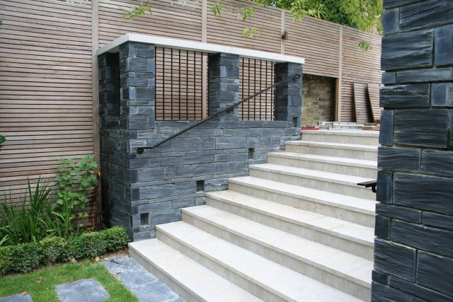 Stylish Formal Garden with terrace receives Highly Commended by Phil Frank in St John's Wood London slatted trellis panels gravel resin paths, children's play.