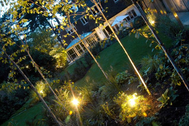 Family Garden Kent designed by Andy Sturgeon creates this Bickley garden constructed to provide a contemporary backdrop to the evergreen hedging planting.