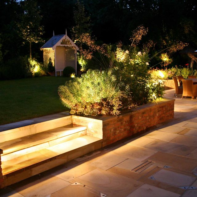 Gerrards Cross Garden Designer Romantic elegant terrace contemporary garden with manicured wide lawn in Northwood West London, striking bespoke cedar pergola.