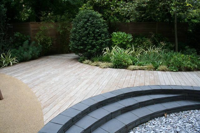 Stylish Formal Garden with terrace receives Highly Commended by Phil Frank in St John's Wood London slatted trellis panels gravel resin paths, children's play.