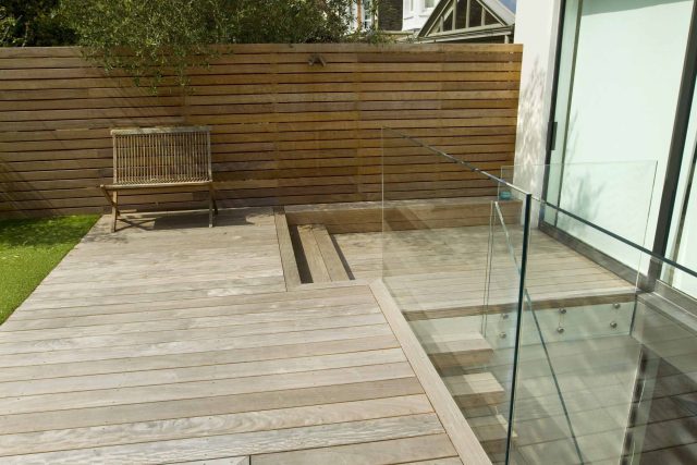 Lane swimming pool and contemporary garden designed and built by The Garden Builders Fulham London SW6, symmetry with the pool strategically planted pockets.