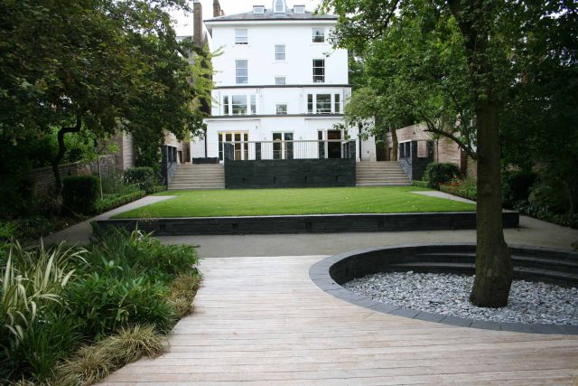 Stylish Formal Garden with terrace receives Highly Commended by Phil Frank in St John's Wood London slatted trellis panels gravel resin paths, children's play.