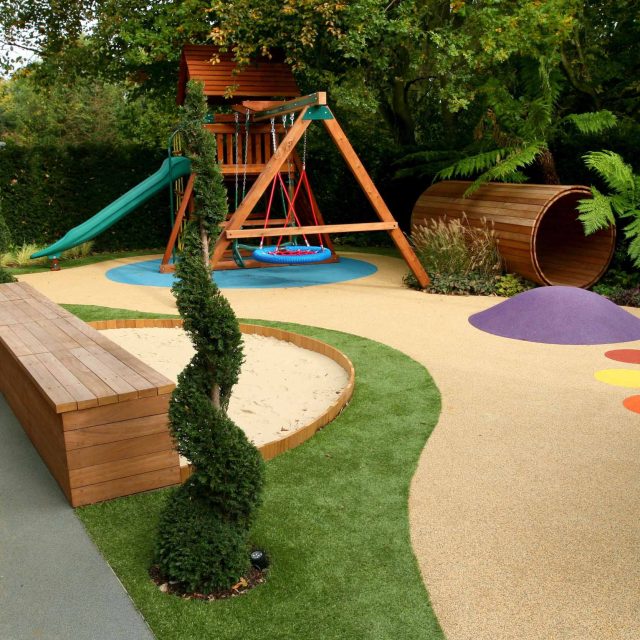 Children's Play Area Garden Design 51 APL Awards 11 The Garden Builders, Hersham, Surrey, featuring a slide, playhouse, trampoline, swings, sand pit, tunnel.
