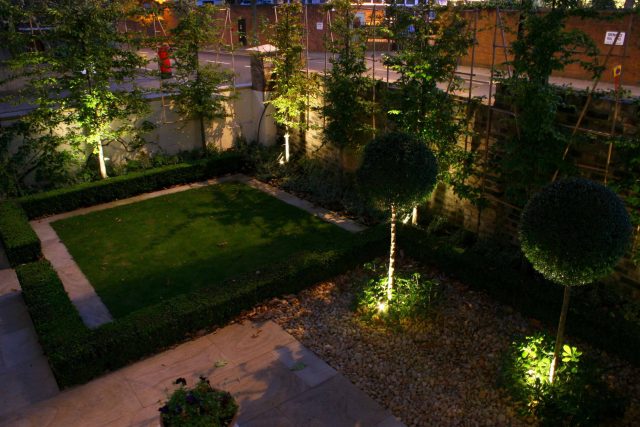 Contemporary garden with formal planting design with resin bonded gravel paths, St Johns Wood, modern family garden accentuated by formal planting, resin path.