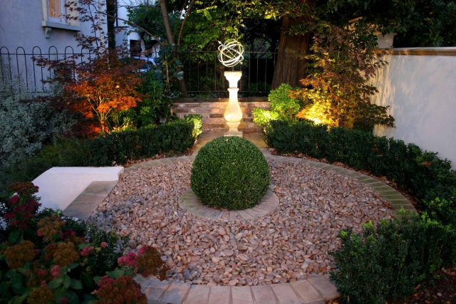 Contemporary garden with formal planting design with resin bonded gravel paths, St Johns Wood, modern family garden accentuated by formal planting, resin path.