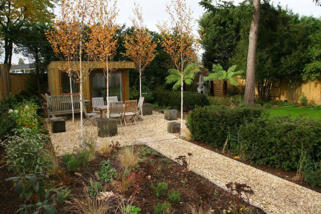 Epsom, Surrey landscaped garden lawn, minimalist design with pebble border and Birch trees, Ewell, Surrey contractor specialists, lawns, pathways, driveways.