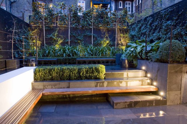 Uncomplicated Contemporary Design in Kensington London designed by award winning Declan Buckley, attractive design terrace entertaining relaxation zone planting.