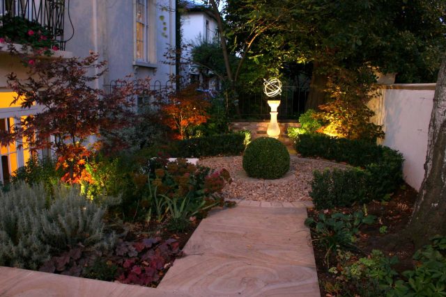 Contemporary garden with formal planting design with resin bonded gravel paths, St Johns Wood, modern family garden accentuated by formal planting, resin path.