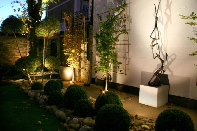 Contemporary garden with formal planting design with resin bonded gravel paths, St Johns Wood, modern family garden accentuated by formal planting, resin path.