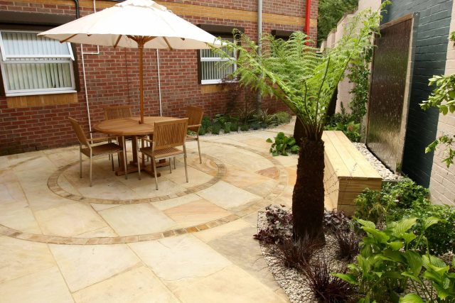 Courtyard garden for NHS GP Practice Balham Surgery south London with water feature and lighting, landscaping consultant contractors lighting, planting.