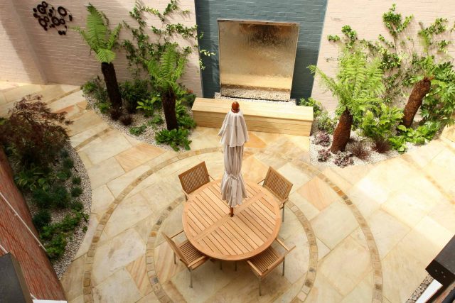 Courtyard garden for NHS GP Practice Balham Surgery south London with water feature and lighting, landscaping consultant contractors lighting, planting.