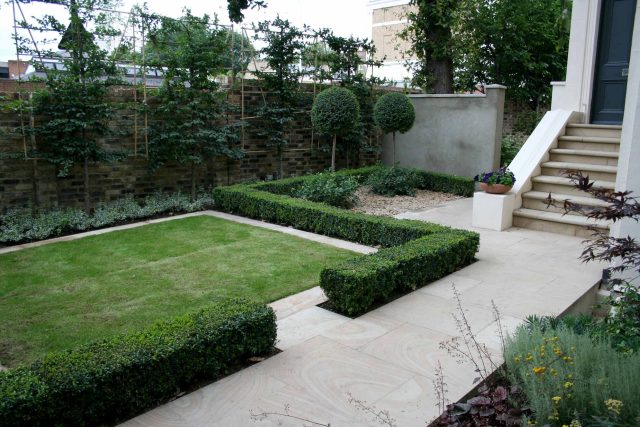 Contemporary garden with formal planting design with resin bonded gravel paths, St Johns Wood, modern family garden accentuated by formal planting, resin path.