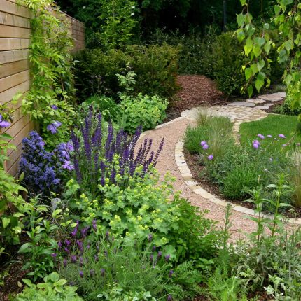 Family Garden in Hill Muswell providing space and tranquillity, modern slatted trellis, hard landscaping, slate terrace