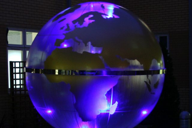 Garden Design Sphere Water Feature set in the courtyard of a London Hospital dynamic steel water feature a clear acrylic sphere included map of the world.