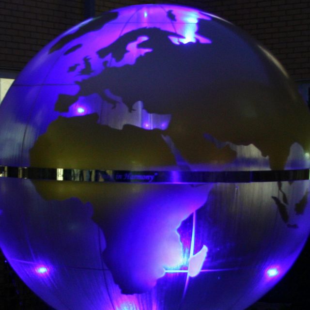 Garden Design Sphere Water Feature set in the courtyard of a London Hospital dynamic steel water feature a clear acrylic sphere included map of the world.