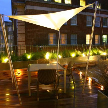City Roof Terrace Marylebone W1 designed by Joan Edlis of Joan Edlis Associates and built by the Garden Builders decked floor surface, stainless steel planters.