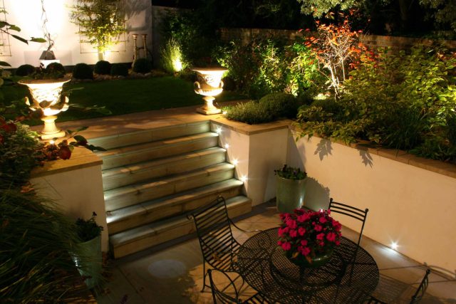 Contemporary garden with formal planting design with resin bonded gravel paths, St Johns Wood, modern family garden accentuated by formal planting, resin path.