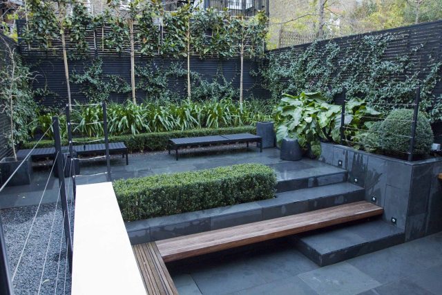Uncomplicated Contemporary Design in Kensington London designed by award winning Declan Buckley, attractive design terrace entertaining relaxation zone planting.