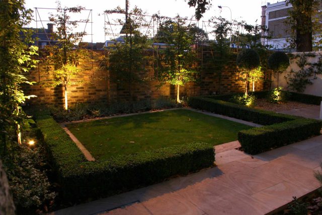 Contemporary garden with formal planting design with resin bonded gravel paths, St Johns Wood, modern family garden accentuated by formal planting, resin path.