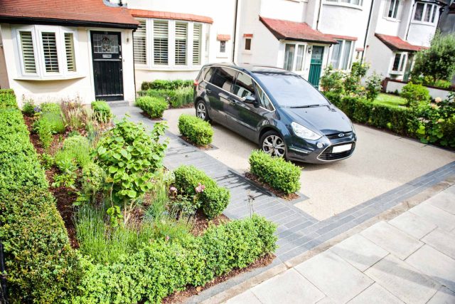 Landscaped multi-levelled contemporary garden designed with basalt paving, bespoke steel planters in Muswell Hill London landscaping contractor designers.