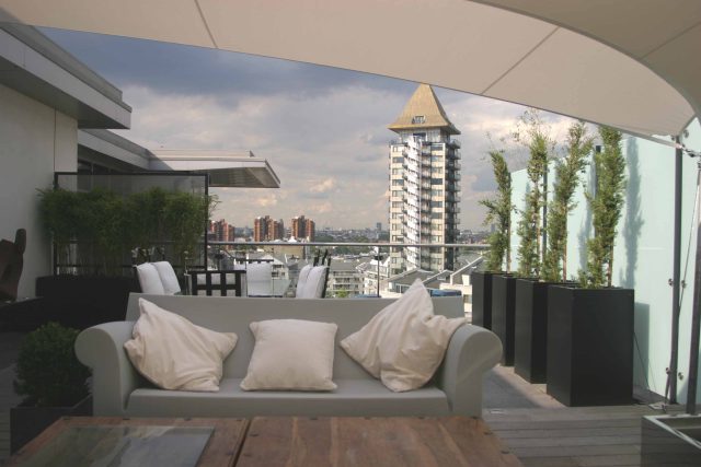 Multi levelled roof garden terrace design long narrow shape by Garden Builders at Imperial Wharf landscaping consultant contractors specialising roof gardens.