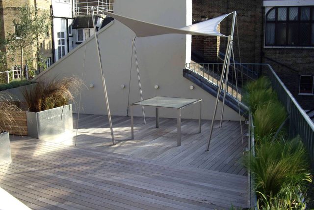 City Roof Terrace Marylebone W1 designed by Joan Edlis of Joan Edlis Associates and built by the Garden Builders decked floor surface, stainless steel planters.