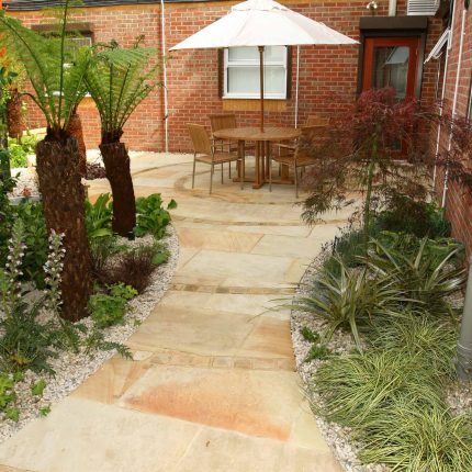Courtyard garden for NHS GP Practice Balham Surgery south London with water feature and lighting, landscaping consultant contractors lighting, planting.