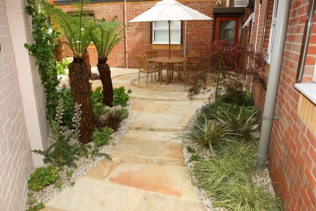 Courtyard garden for NHS GP Practice Balham Surgery south London with water feature and lighting, landscaping consultant contractors lighting, planting.