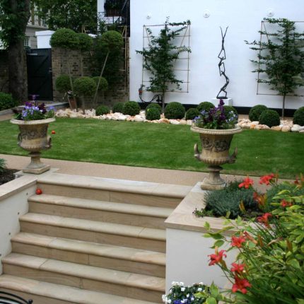 Contemporary garden with formal planting design with resin bonded gravel paths, St Johns Wood, modern family garden accentuated by formal planting, resin path.