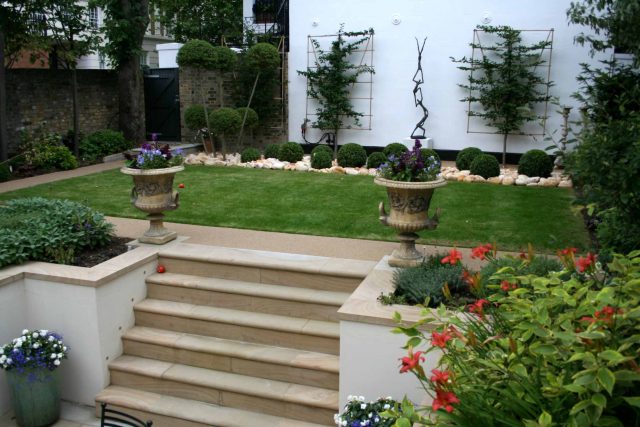 Contemporary garden with formal planting design with resin bonded gravel paths, St Johns Wood, modern family garden accentuated by formal planting, resin path.