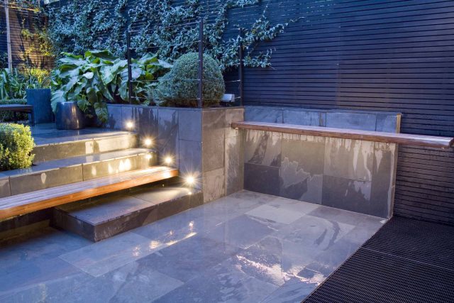 Uncomplicated Contemporary Design in Kensington London designed by award winning Declan Buckley, attractive design terrace entertaining relaxation zone planting.