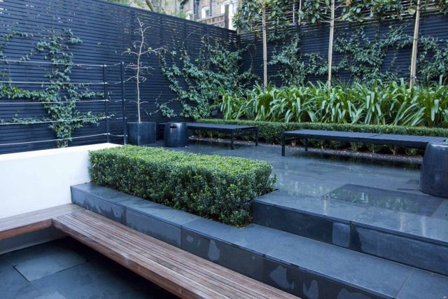 Uncomplicated Contemporary Design in Kensington London designed by award winning Declan Buckley, attractive design terrace entertaining relaxation zone planting.