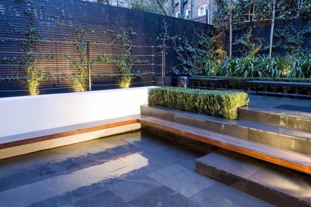 Uncomplicated Contemporary Design in Kensington London designed by award winning Declan Buckley, attractive design terrace entertaining relaxation zone planting.