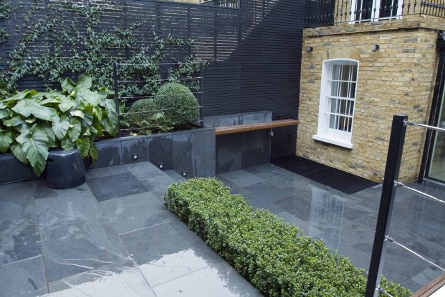 Uncomplicated Contemporary Design in Kensington London designed by award winning Declan Buckley, attractive design terrace entertaining relaxation zone planting.