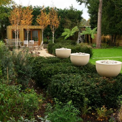 Epsom, Surrey landscaped garden lawn, minimalist design with pebble border and Birch trees, Ewell, Surrey contractor specialists, lawns, pathways, driveways.