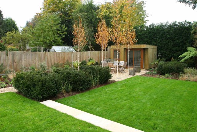 Epsom, Surrey landscaped garden lawn, minimalist design with pebble border and Birch trees, Ewell, Surrey contractor specialists, lawns, pathways, driveways.