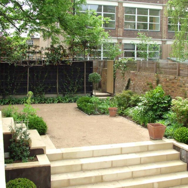 Declan Buckley contemporary small garden Putney a clever design for a space uses pale Blanc de Bierge paving to offset the deep brown cedar sophisticated screen.