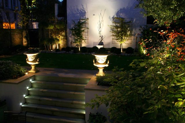 Contemporary garden with formal planting design with resin bonded gravel paths, St Johns Wood, modern family garden accentuated by formal planting, resin path.