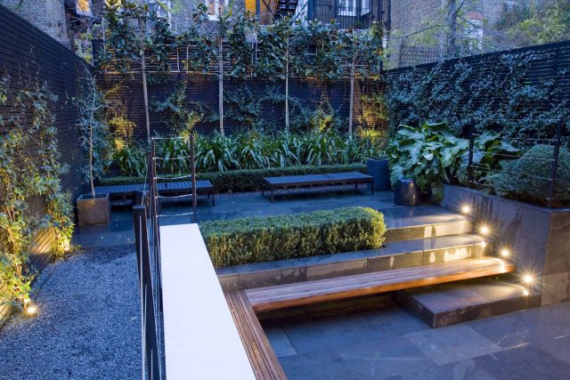 Uncomplicated Contemporary Design in Kensington London designed by award winning Declan Buckley, attractive design terrace entertaining relaxation zone planting.