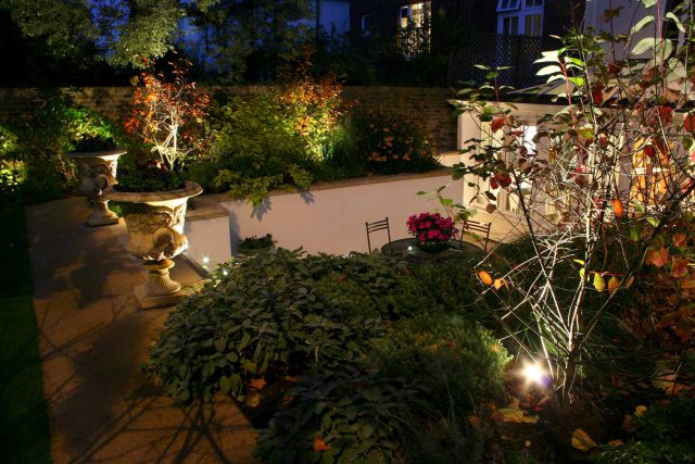 Contemporary garden with formal planting design with resin bonded gravel paths, St Johns Wood, modern family garden accentuated by formal planting, resin path.