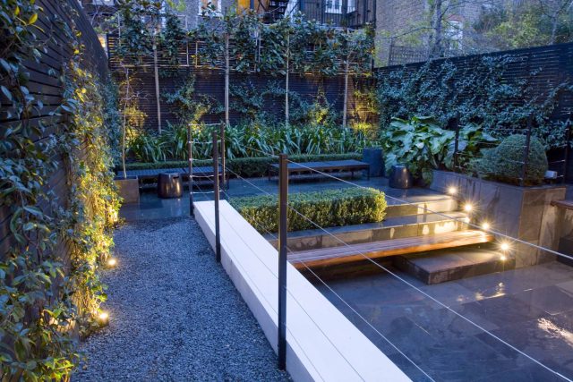 Uncomplicated Contemporary Design in Kensington London designed by award winning Declan Buckley, attractive design terrace entertaining relaxation zone planting.