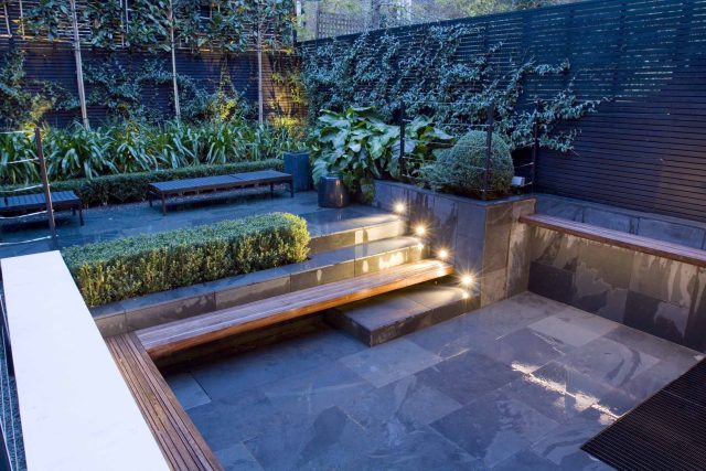 Uncomplicated Contemporary Design in Kensington London designed by award winning Declan Buckley, attractive design terrace entertaining relaxation zone planting.