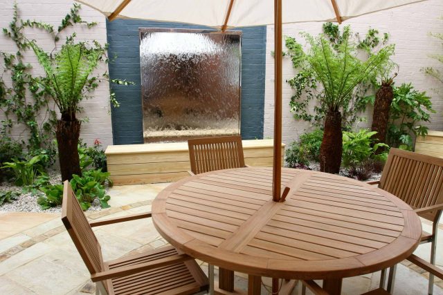 Courtyard garden for NHS GP Practice Balham Surgery south London with water feature and lighting, landscaping consultant contractors lighting, planting.