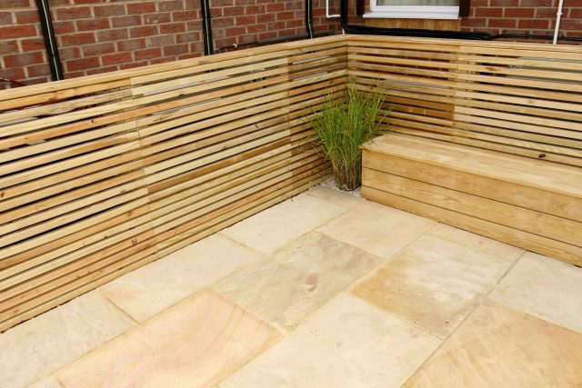 Courtyard garden for NHS GP Practice Balham Surgery south London with water feature and lighting, landscaping consultant contractors lighting, planting.