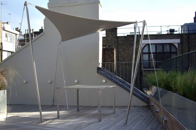 City Roof Terrace Marylebone W1 designed by Joan Edlis of Joan Edlis Associates and built by the Garden Builders decked floor surface, stainless steel planters.