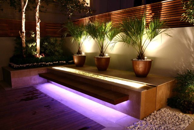 Contemporary outdoor garden space designed by Kate Gould and built by the Garden Builders, water feature, floating bench, cedar bench, landscaping contractors.