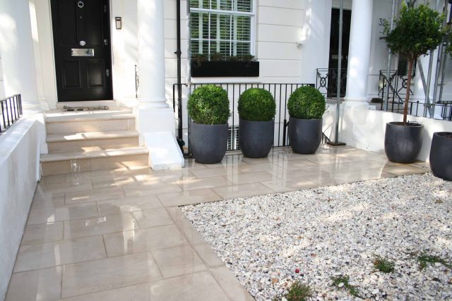 Garden Designer Chelsea Chic Modern Refinement Charm Landscape Contractor with steps sleek lines and flooring was laid with white limestone by Declan Buckley.