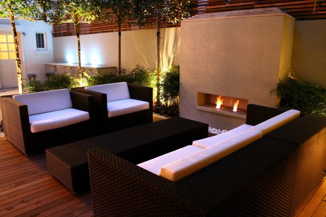 Contemporary outdoor garden space designed by Kate Gould and built by the Garden Builders, water feature, floating bench, cedar bench, landscaping contractors.