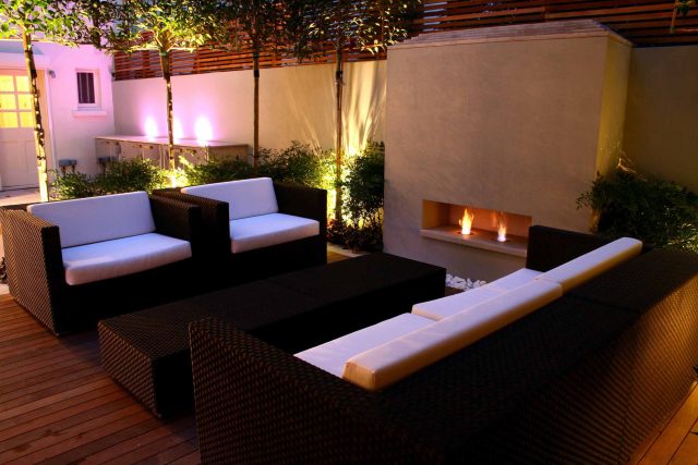 Contemporary outdoor garden space designed by Kate Gould and built by the Garden Builders, water feature, floating bench, cedar bench, landscaping contractors.