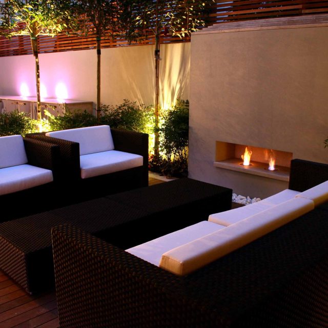 Contemporary outdoor garden space designed by Kate Gould and built by the Garden Builders, water feature, floating bench, cedar bench, landscaping contractors.